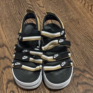 Nike Women’s Black and Gold Striped Sandals